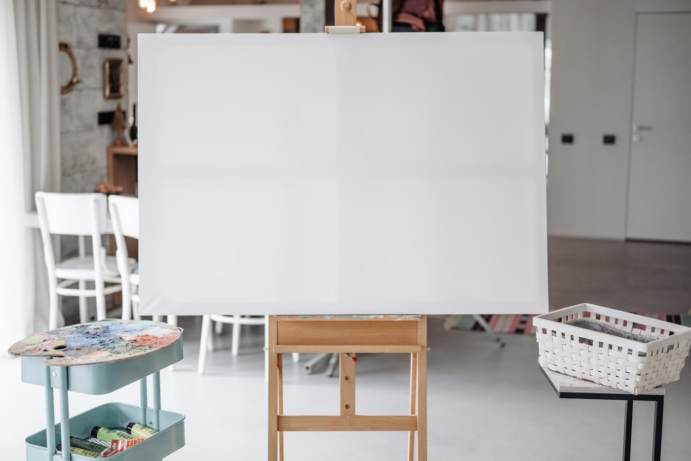 Creative art studio with an easel and painting materials